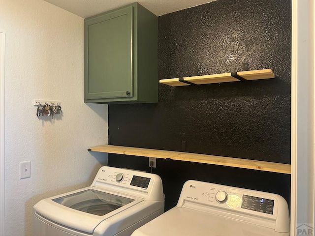 laundry area with cabinet space and washing machine and clothes dryer