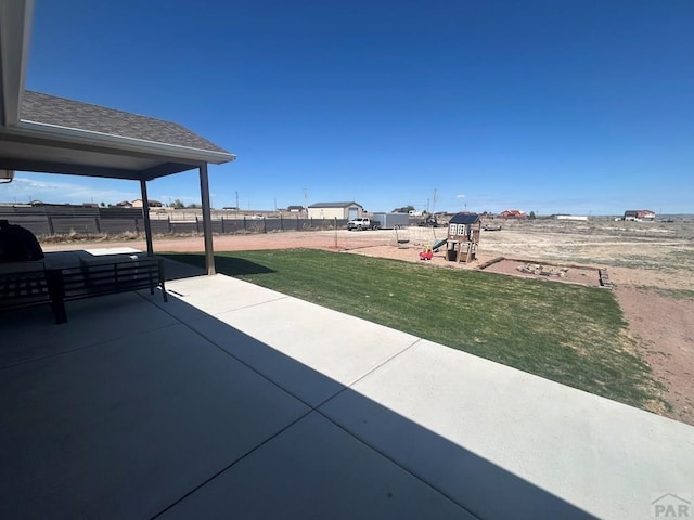 view of patio with fence and playground community