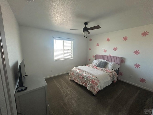 carpeted bedroom with baseboards and a ceiling fan