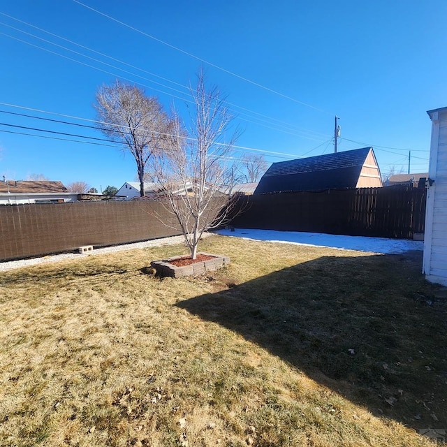 view of yard with a fenced backyard