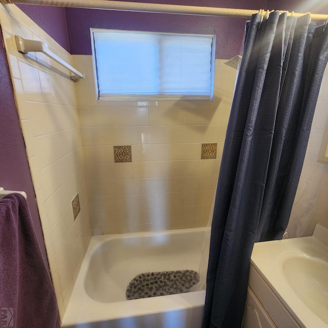 full bathroom with vanity and shower / bathtub combination with curtain