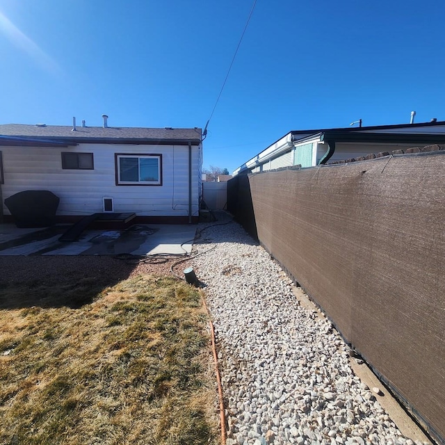 exterior space featuring a patio area and a fenced backyard