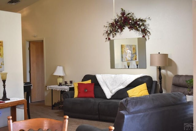 living room featuring carpet floors and visible vents