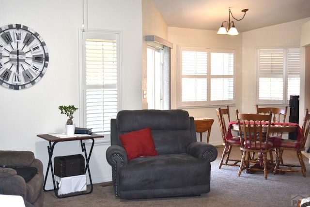 interior space featuring carpet and a notable chandelier