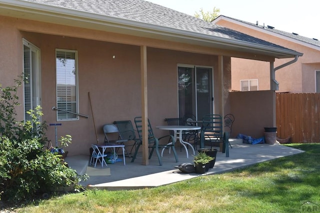 view of patio featuring fence