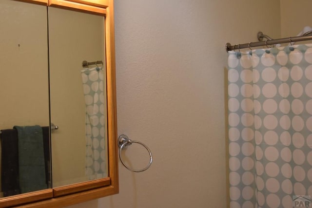 bathroom with a shower