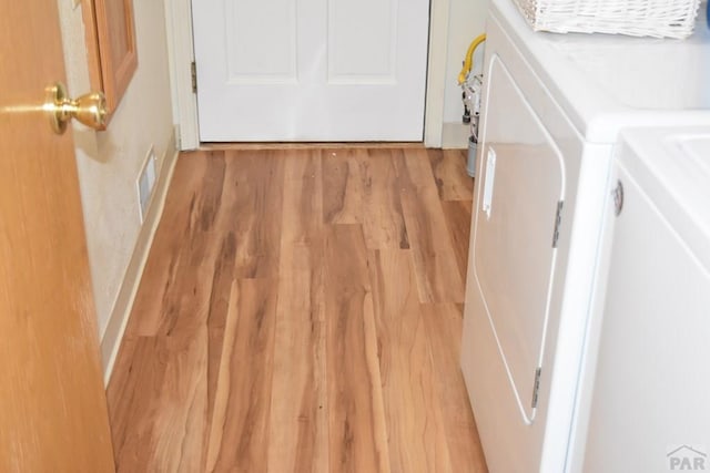 laundry room featuring laundry area, visible vents, light wood-style floors, and independent washer and dryer