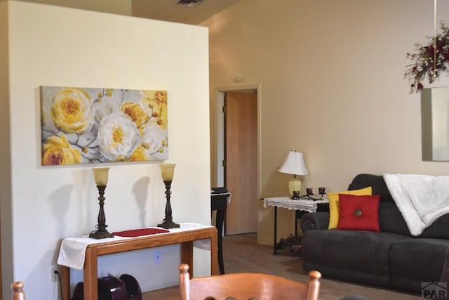 living area with carpet and visible vents