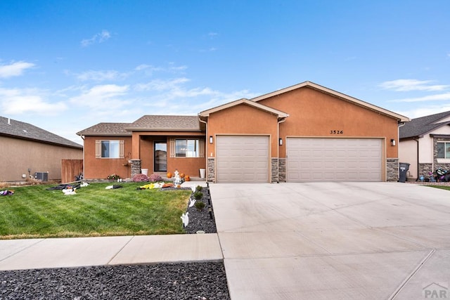 view of front of home featuring stucco siding, concrete driveway, a front yard, a garage, and stone siding