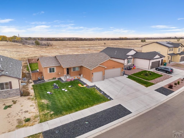 birds eye view of property with a residential view