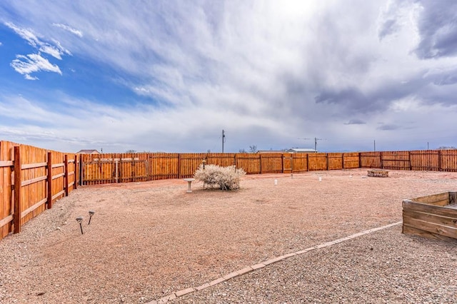 view of yard with a fenced backyard