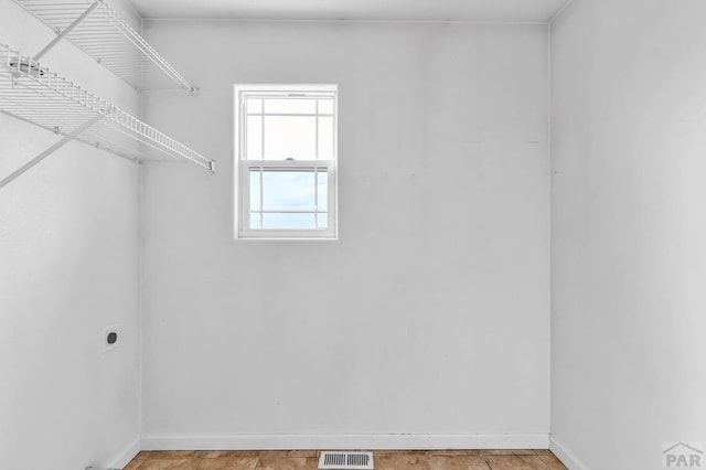 walk in closet featuring visible vents