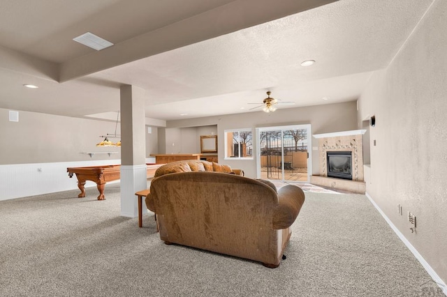 living area with a tile fireplace, billiards, carpet flooring, a ceiling fan, and baseboards