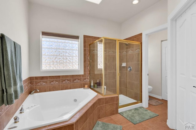 full bath with a stall shower, toilet, a bath, and tile patterned floors