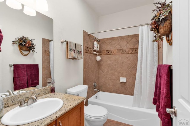 full bathroom featuring toilet, shower / bath combo, and vanity