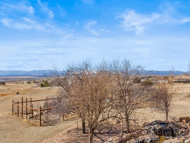 view of mountain feature with a rural view