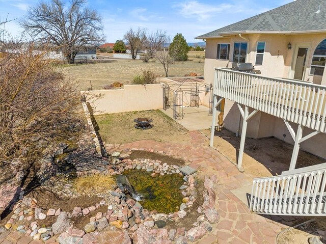 view of yard featuring a patio area and a fire pit