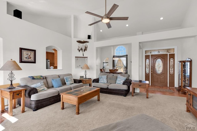 carpeted living room featuring high vaulted ceiling, a ceiling fan, and recessed lighting