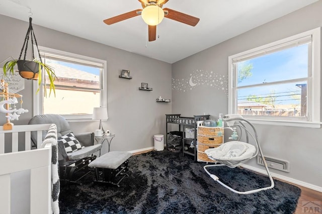 bedroom with baseboards and a ceiling fan