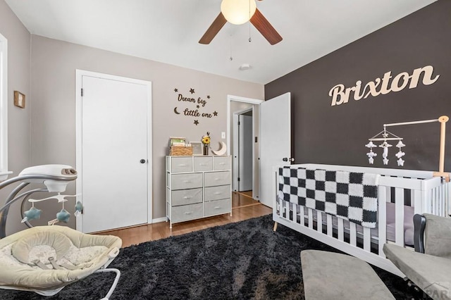 bedroom featuring ceiling fan and wood finished floors
