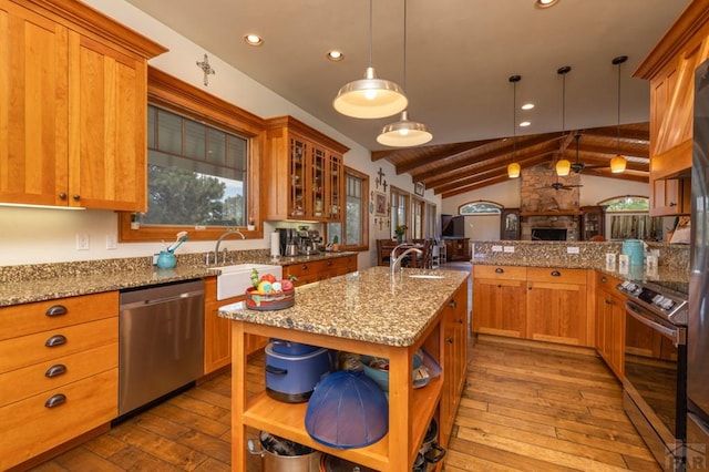 kitchen with lofted ceiling with beams, wood-type flooring, stainless steel appliances, open shelves, and a sink