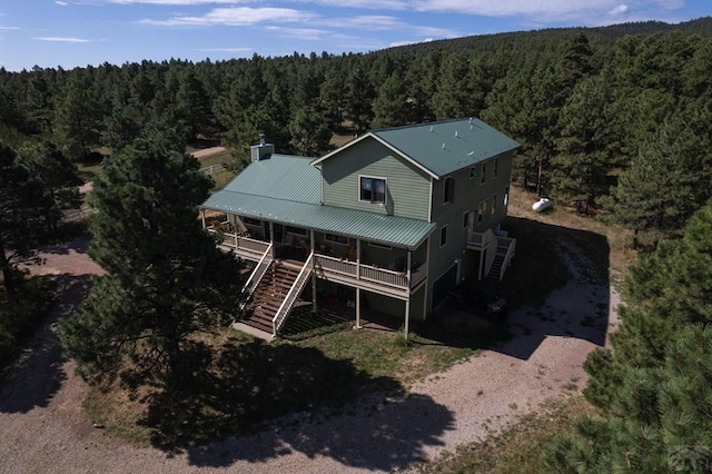 drone / aerial view with a view of trees