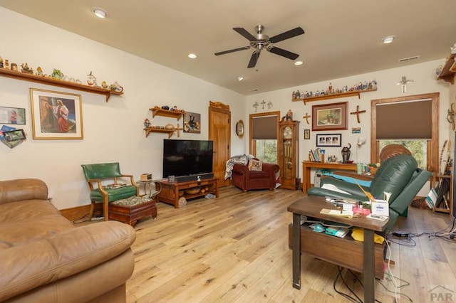 living room with a ceiling fan, light wood-type flooring, visible vents, and recessed lighting