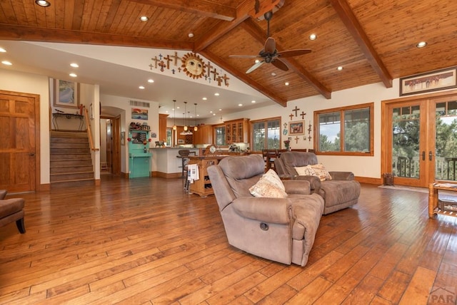 living room with hardwood / wood-style flooring, wood ceiling, stairs, and beam ceiling