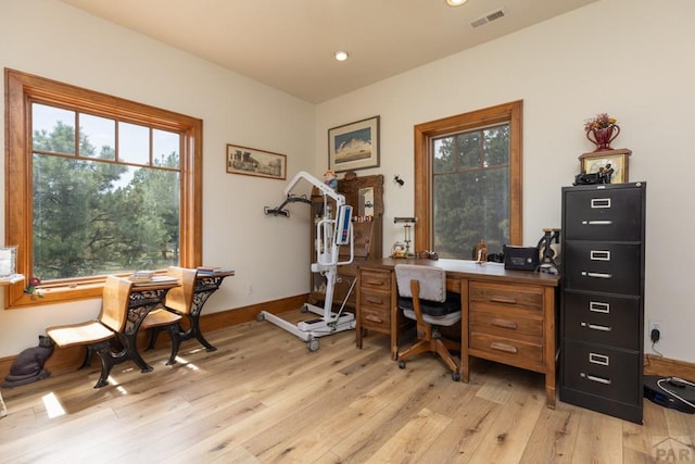 office with light wood-style floors, baseboards, visible vents, and recessed lighting