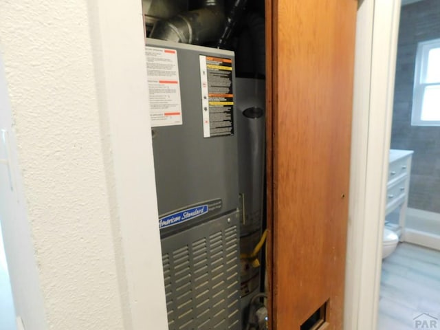 utility room with heating unit