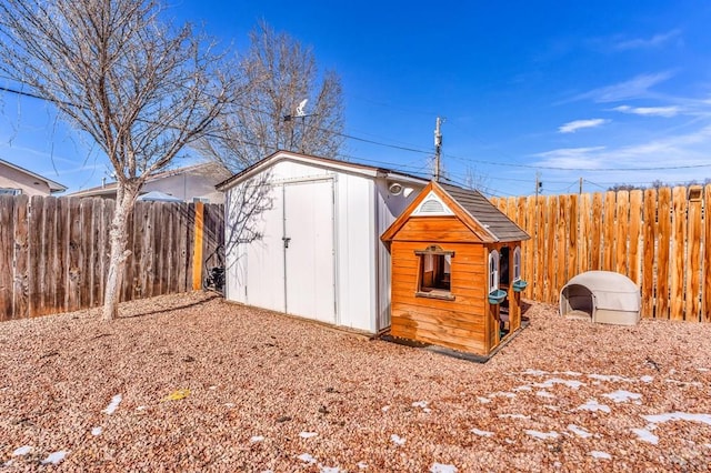 view of shed featuring a fenced backyard