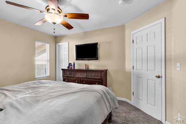 bedroom featuring carpet flooring, a ceiling fan, and baseboards