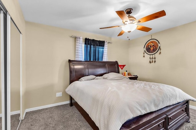 bedroom featuring light carpet, a closet, baseboards, and a ceiling fan