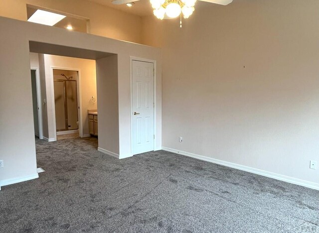 165 Kingsley Ave Unit M, Pueblo, CO 81005 - empty room featuring dark colored carpet, a ceiling fan, and baseboards