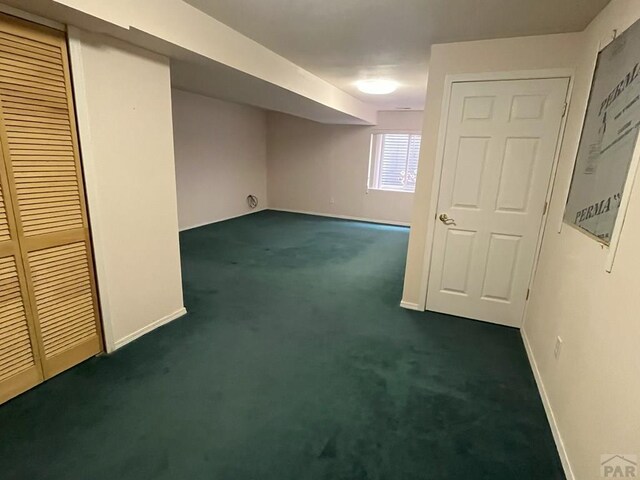 165 Kingsley Ave Unit M, Pueblo, CO 81005 - basement featuring dark colored carpet and baseboards