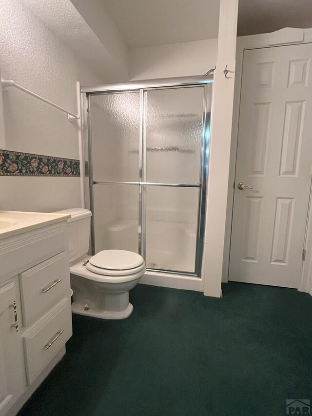 165 Kingsley Ave Unit M, Pueblo, CO 81005 - bathroom with a stall shower, toilet, and vanity