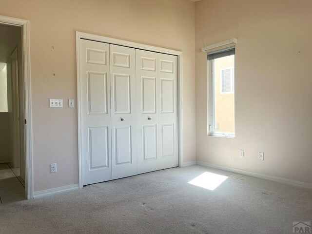 165 Kingsley Ave Unit M, Pueblo, CO 81005 - unfurnished bedroom with carpet, a closet, and baseboards