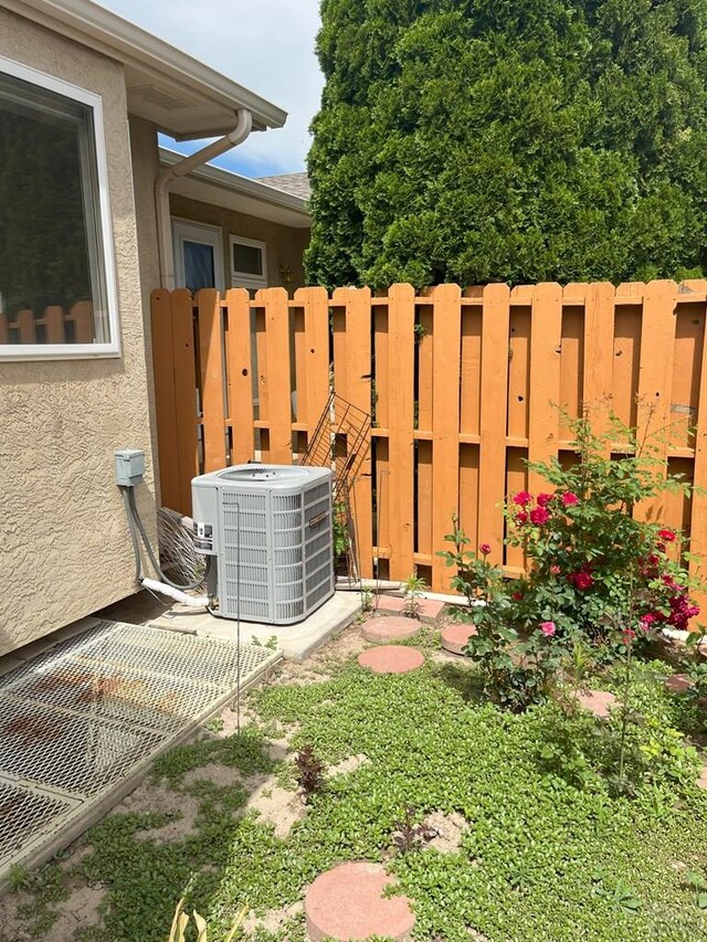 165 Kingsley Ave Unit M, Pueblo, CO 81005 - exterior view of central air condition unit and stucco siding