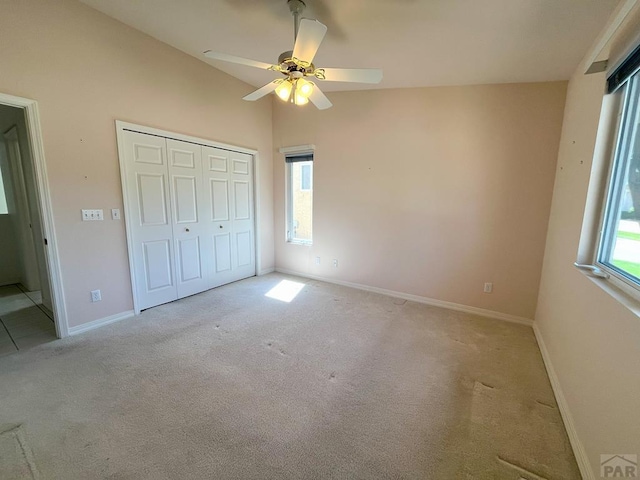 165 Kingsley Ave Unit M, Pueblo, CO 81005 - unfurnished bedroom featuring light carpet, a closet, baseboards, and a ceiling fan