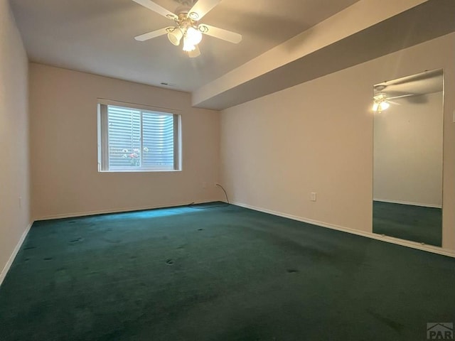 165 Kingsley Ave Unit M, Pueblo, CO 81005 - spare room featuring carpet flooring, ceiling fan, and baseboards
