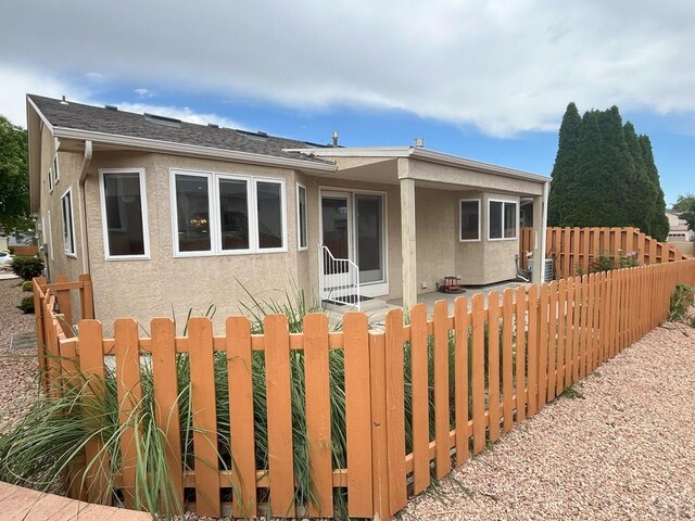 165 Kingsley Ave Unit M, Pueblo, CO 81005 - rear view of property featuring stucco siding
