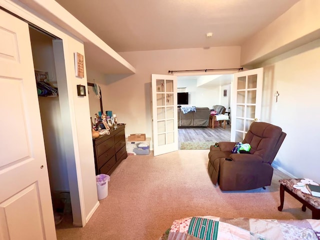 living area with carpet flooring and french doors