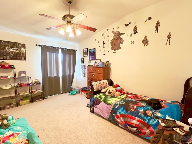 carpeted bedroom featuring vaulted ceiling and a ceiling fan