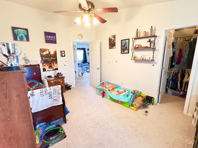 recreation room with ceiling fan and carpet floors