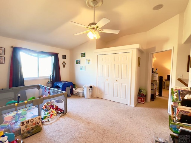 playroom with lofted ceiling, carpet, and ceiling fan