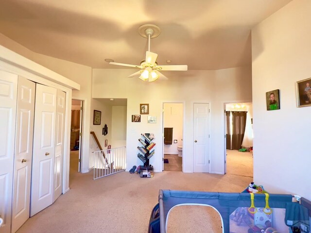 game room featuring a ceiling fan and light colored carpet