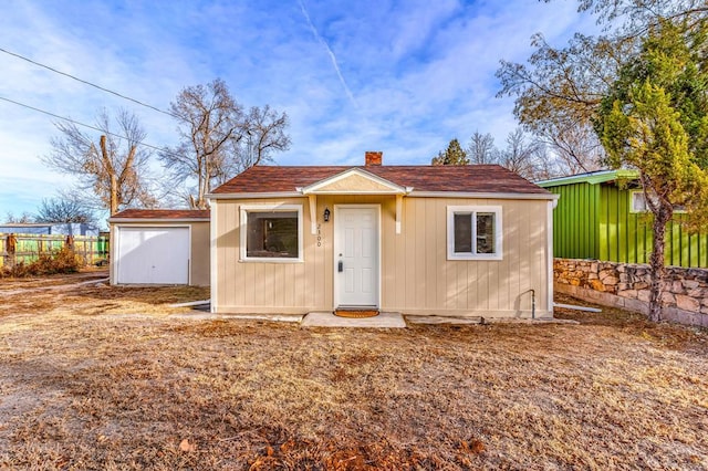 bungalow with fence and a chimney