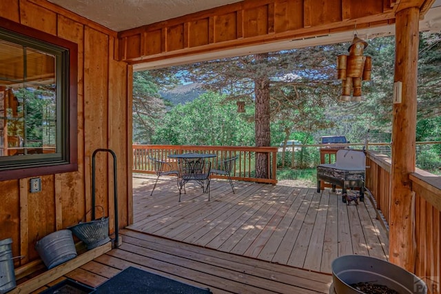 wooden deck with outdoor dining space