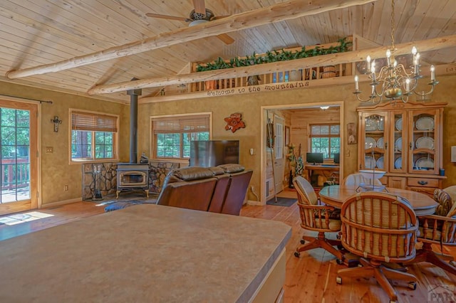 dining area with vaulted ceiling with beams, light wood-style flooring, and a wealth of natural light