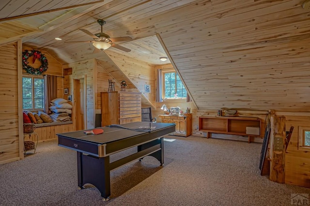 rec room featuring light colored carpet, wood ceiling, vaulted ceiling, wood walls, and ceiling fan